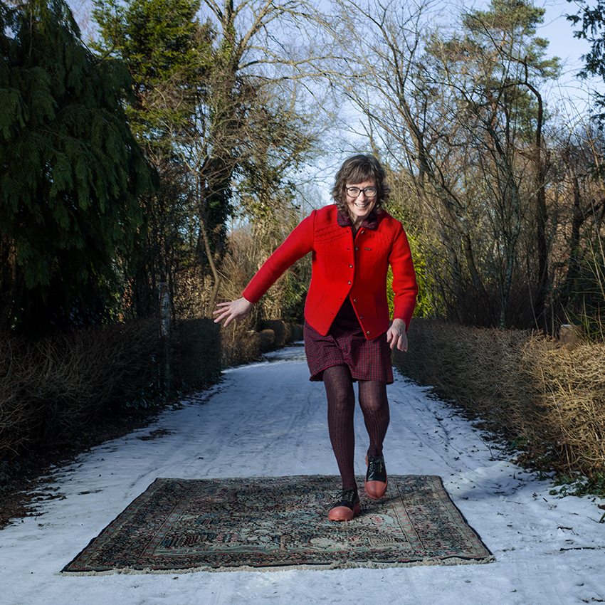 Lucy Lambriex "running" on Persian rug outdoors